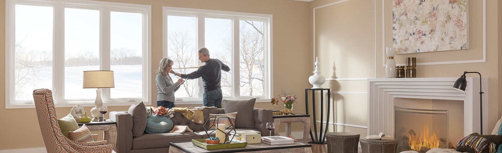 couple measuring windows for curtains