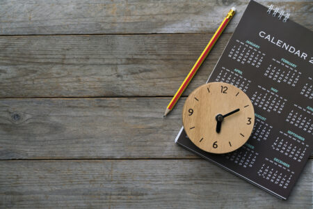 clock and calendar on table